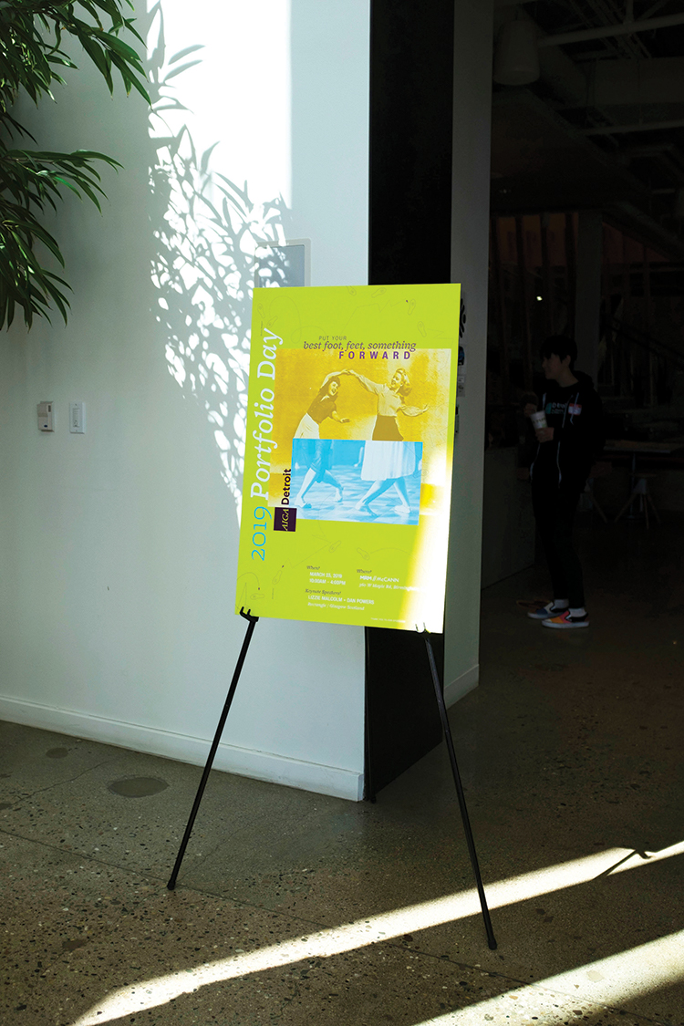 AIGA Student Portfolio Day printed poster inside the venue.