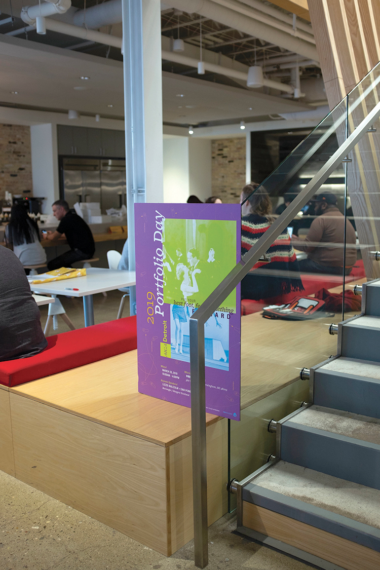 AIGA Student Portfolio Day printed poster inside the venue.